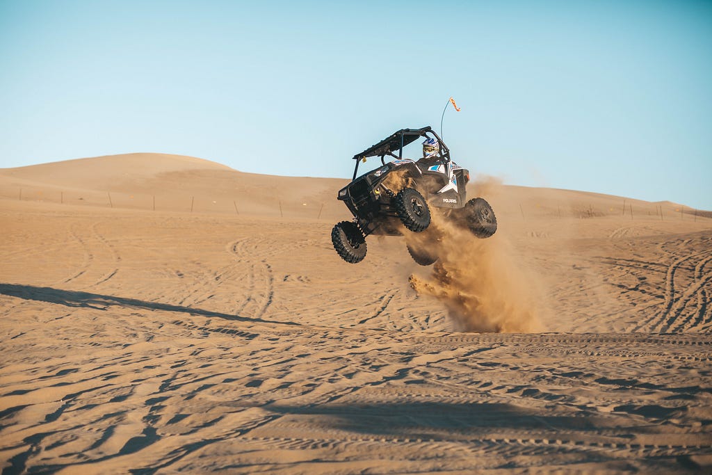 dune buggy riding in desert