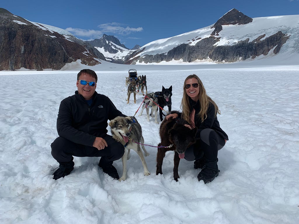 Lisa and Ronnie with sled dogs on Mendenhall Glacier in Juneau Alaska