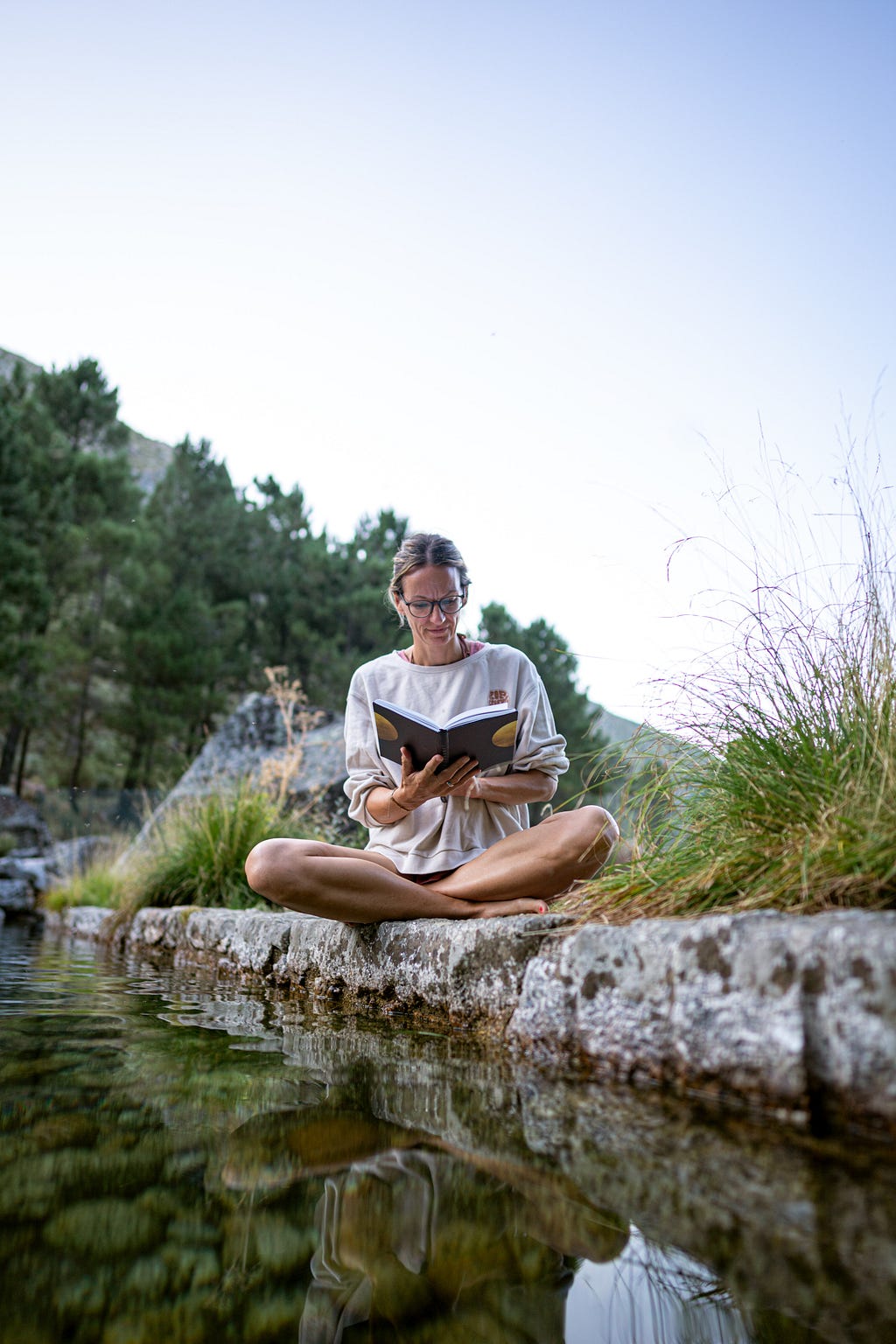 mindfulness a woman reading nature calm serene meditation