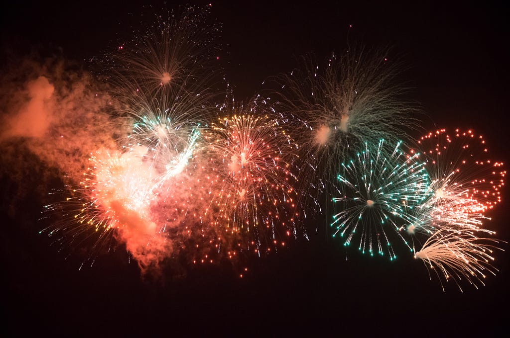 Fireworks of the colors red and blue during the nighttime.