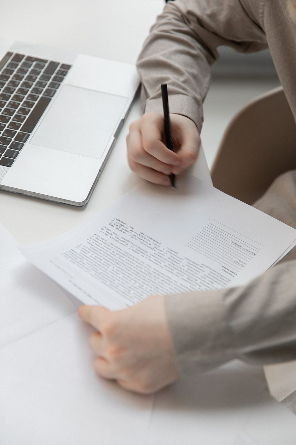 Person signing a document.