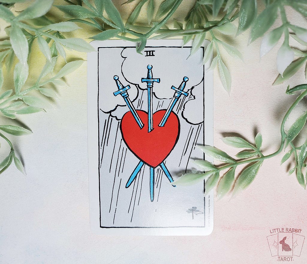 The “Three of Swords” card from the Rider Waite Smith deck.