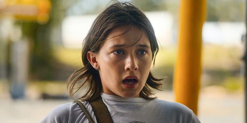 A screencap from the film showing Cailee Spaeny’s Jessie in a state of shock.