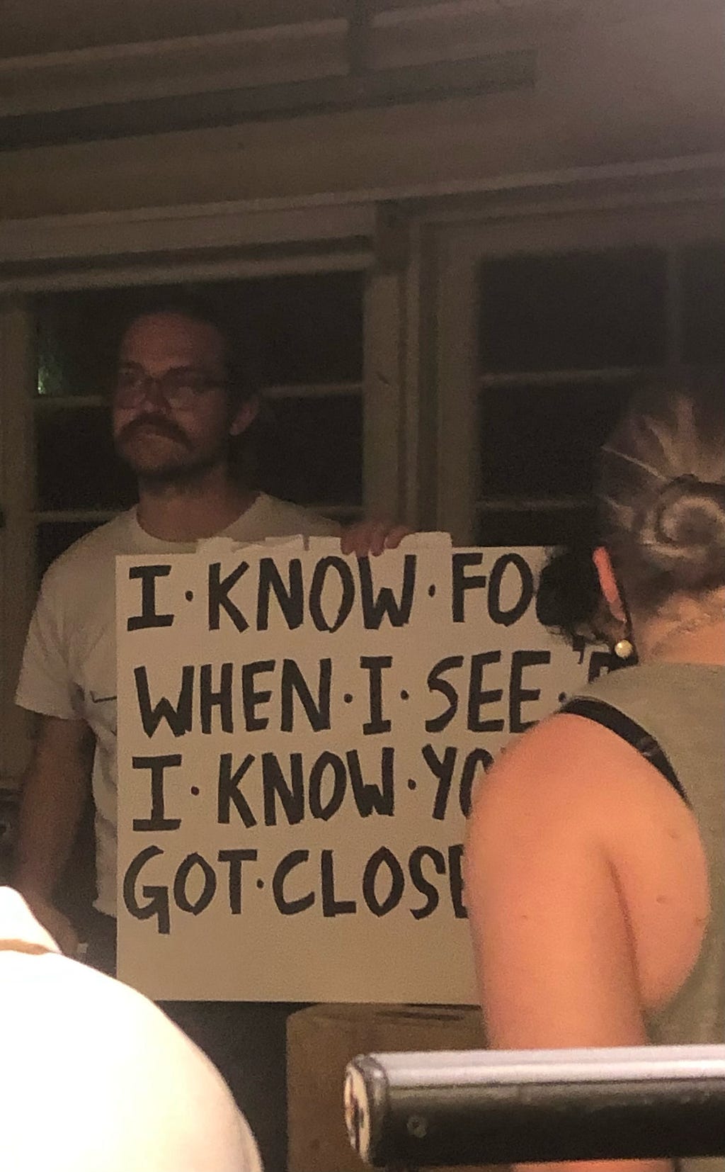 Me, Mitchell Crispi, holding a cue card on a set. The card aptly reads “I know fools when I see them,” though you cannot see the entirety of the card in the photo.