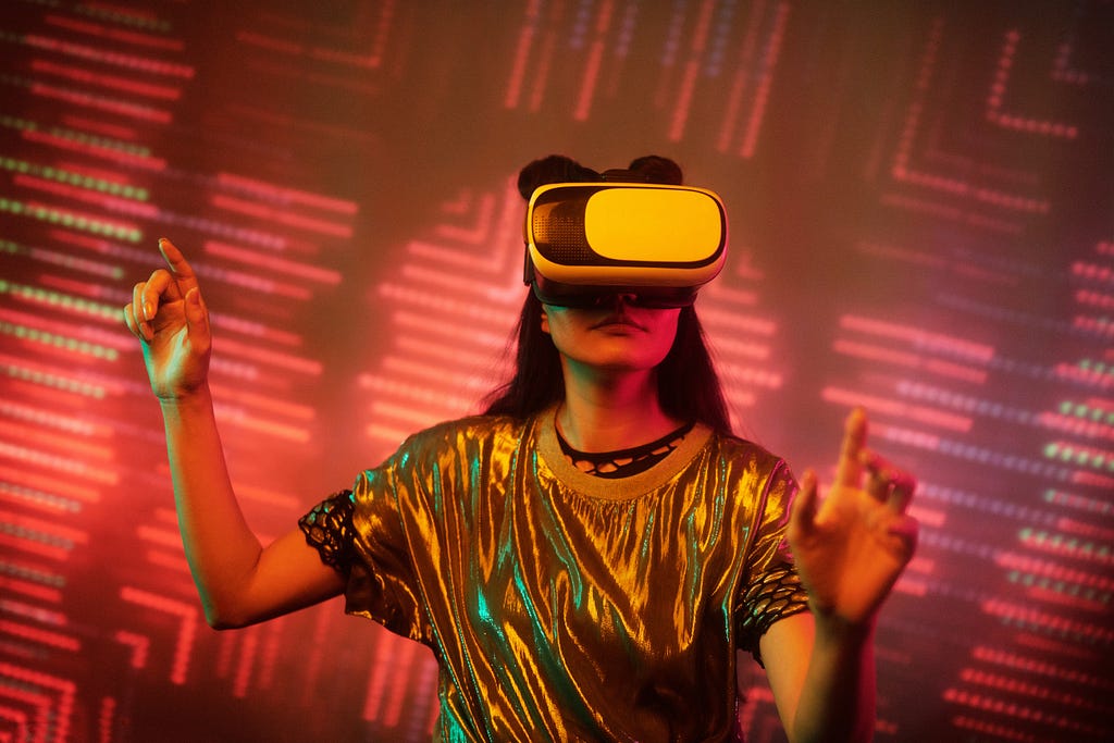 A woman is wearing a VR headset and she is surrounded by colorful visualizations. Her hands are spread as if she was playing in a VR game or exploring a new space.