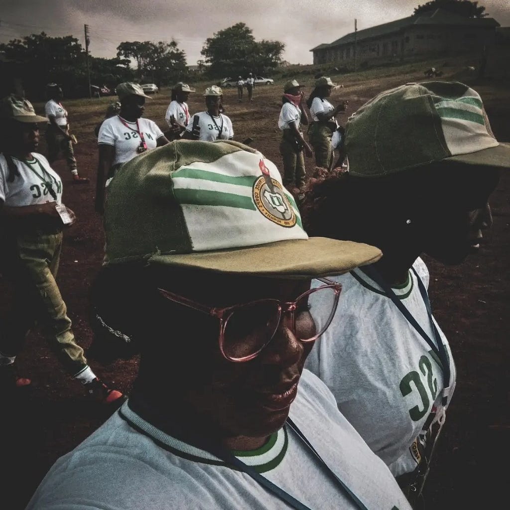 NYSC corp members moving to the parade ground for their swearing in ceremony