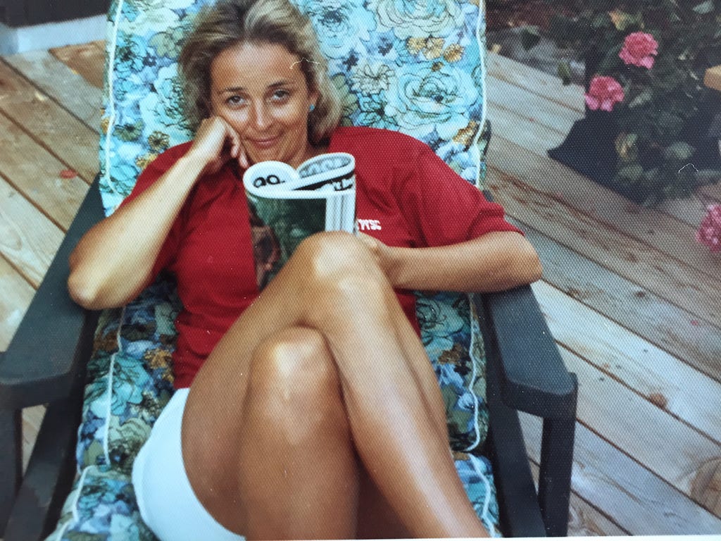 My mother Larieta at my childhood home, early 1970s, reading Cosmopolitan.