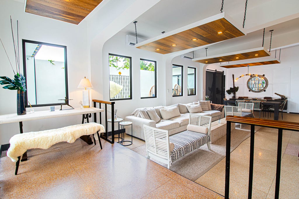 Gorgeous interior of the Grand Living Room at Villa Azure, with stunning interior design featuring natural wood designs.