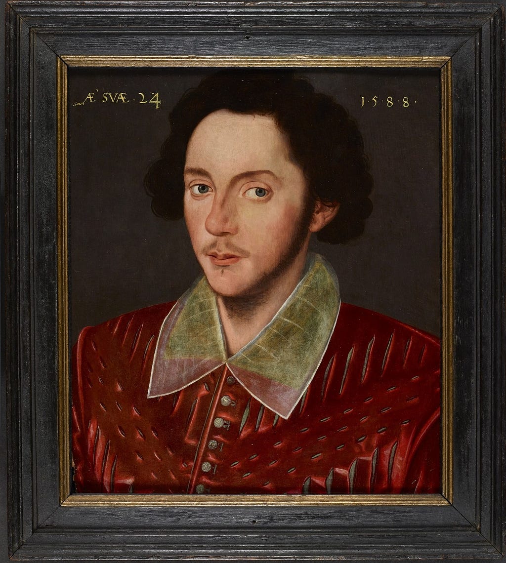 Portrait of a dark haired man wearing in a collared red shirt. The oil painting is surrounded by a dark wooden frame.