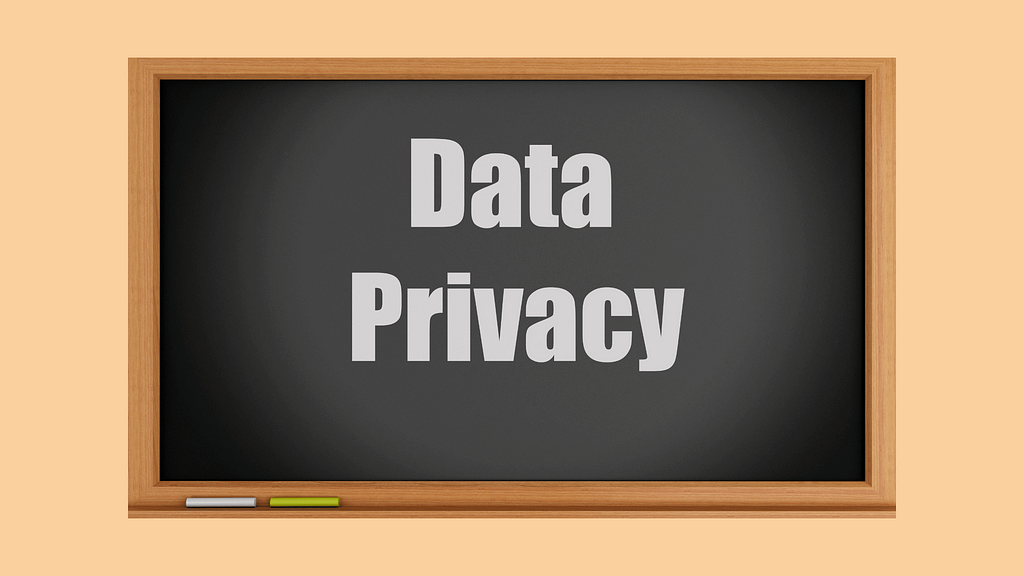 Data privacy written on a black board