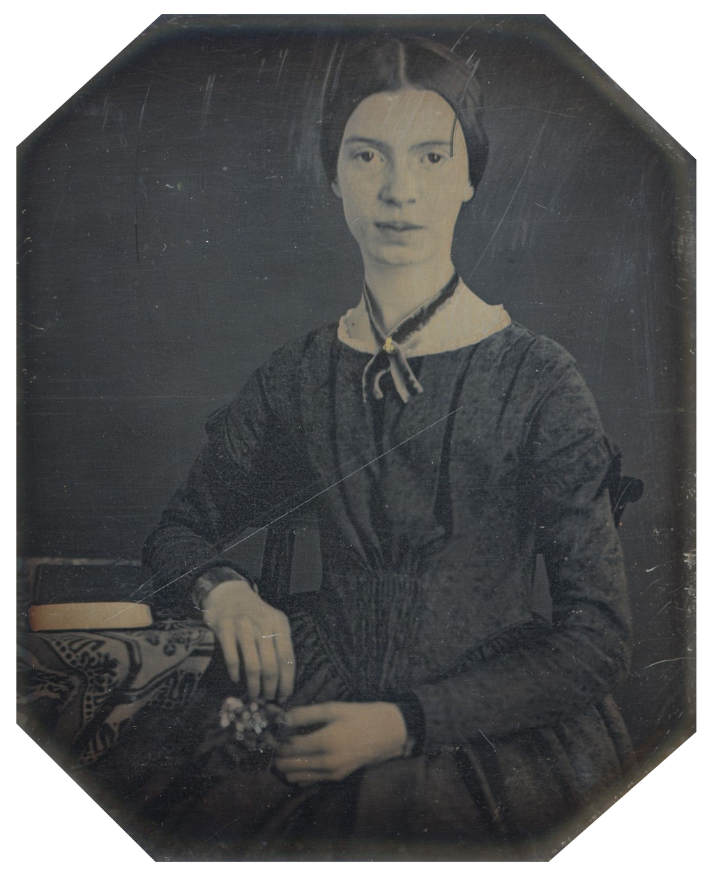 A public domain image of Emily Dickinson from Wikimedia Commons. https://commons.wikimedia.org/wiki/File:Black-white_photograph_of_Emily_Dickinson2.png