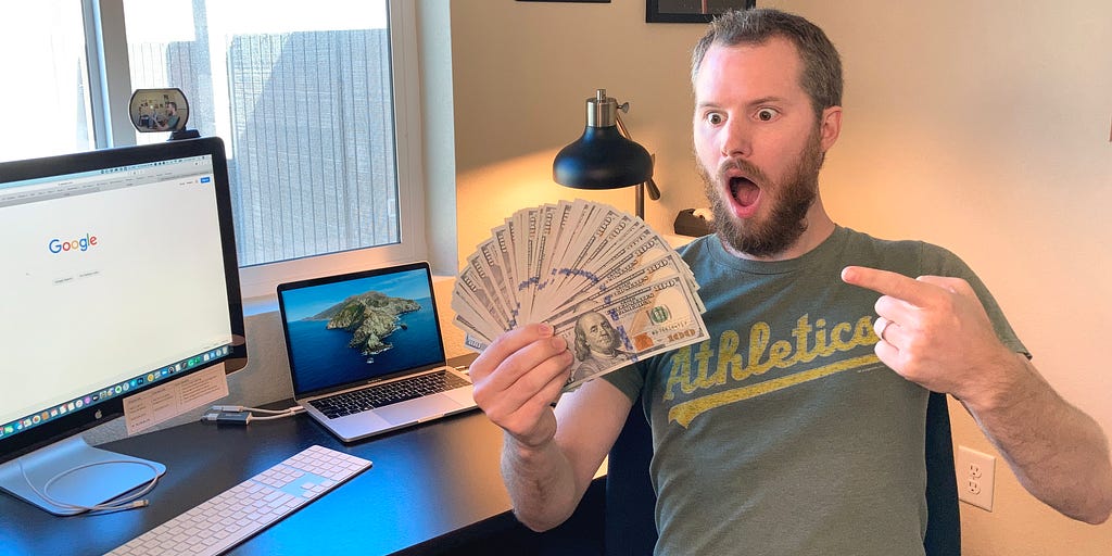 A man holding $10,000 cash in $100 bills and pointing at the money with a shocked face