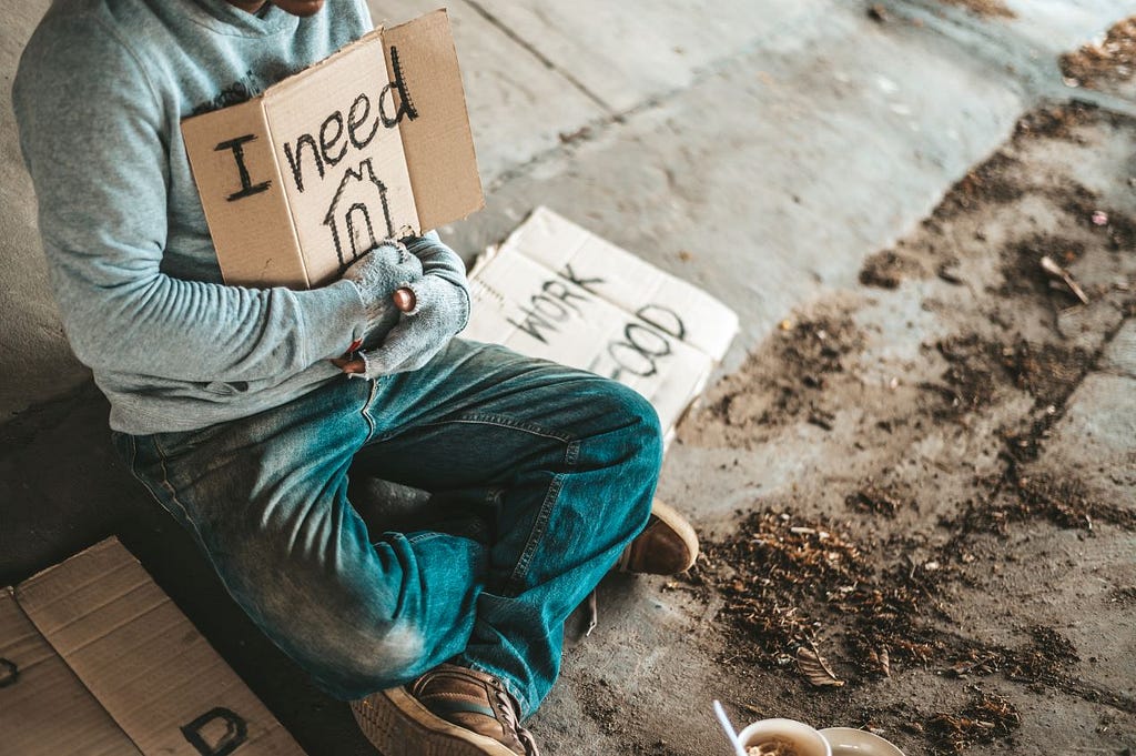 a photo of a homeless encouraging people about helping the homeless