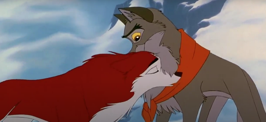 Jenna nudges Balto gently under his chin after giving him her scarf.