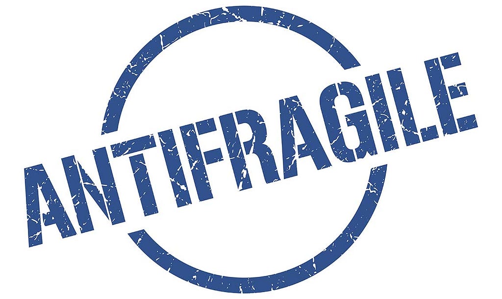 Stamped sign reading “Antifragile” in all caps.