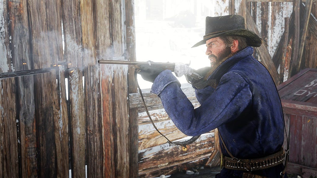 Arthur shooting with a rifle in the snow