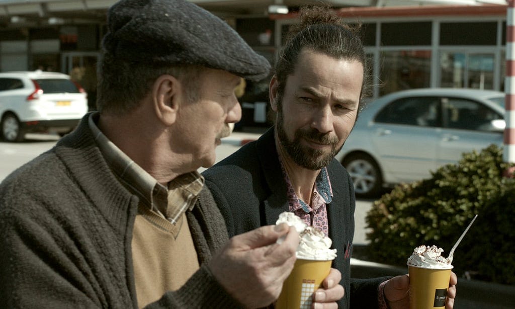 Two men eating ice cream — scene from Wajib (2017)