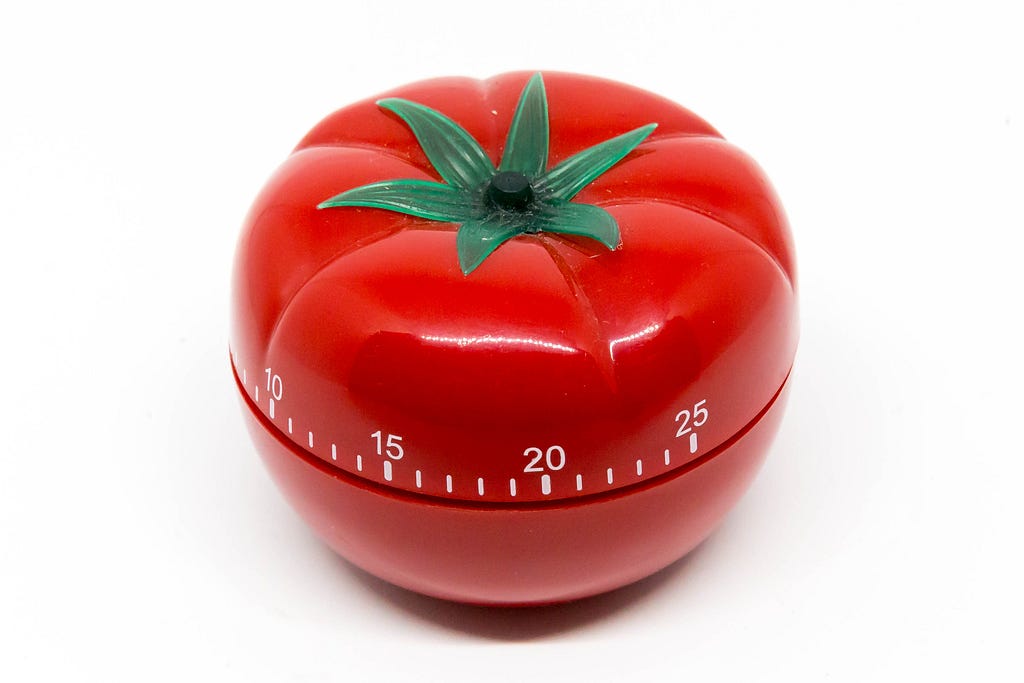 Photograph of an egg timer shaped like a tomato