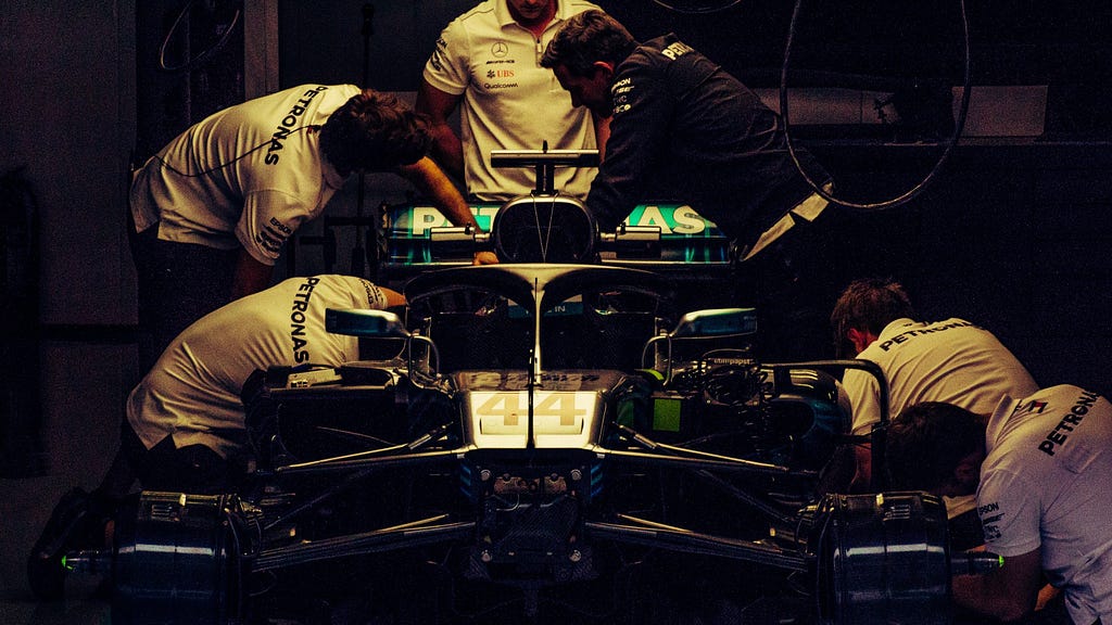 Mercedes mechanics working on their Formula 1 car