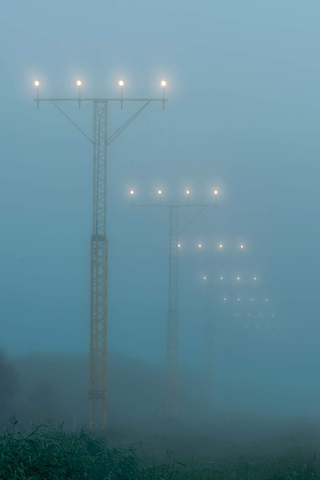 Photo of approach lights in the fog.