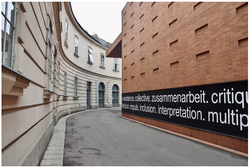 Brown brick building with writing