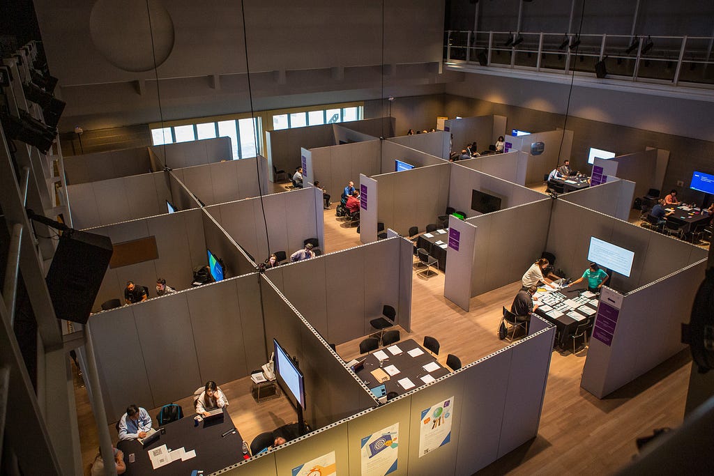 Cubicles of tables inside of the theater where focus group sessions are held
