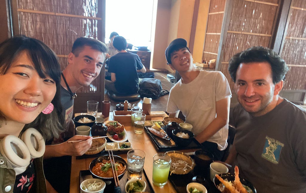 Four people in a Japanese restaurant, including a guest who we met in PyCon, two members of the recruiting team, and the author.