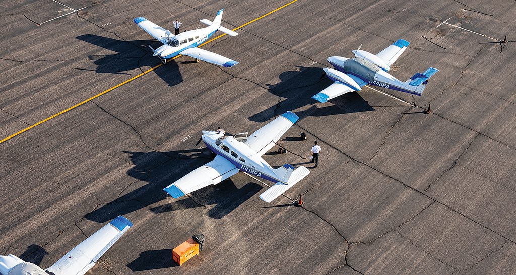 Photo of small airplanes on the tarmac.