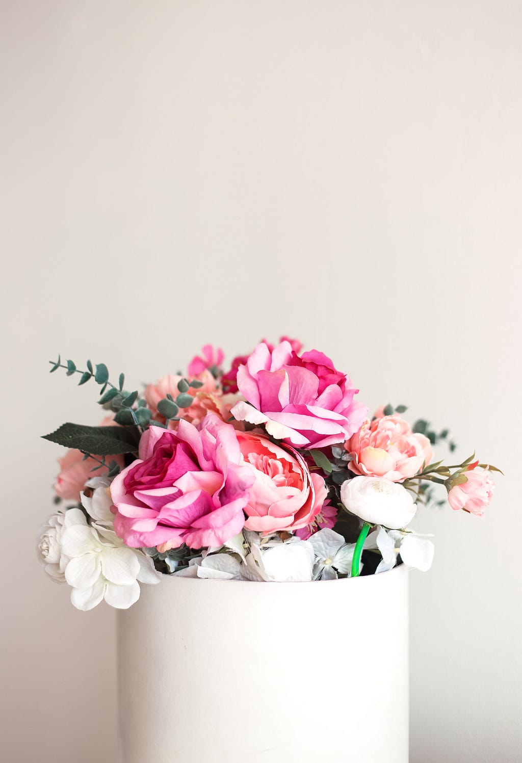 A bouquet of mostly pink and some white flowers.