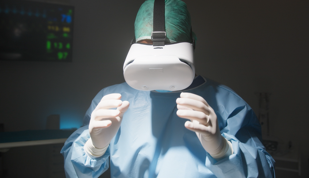 Med doctor, surgeon, practicing surgery in a VR headset.