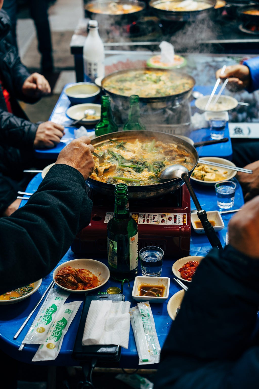 People eating korean food.