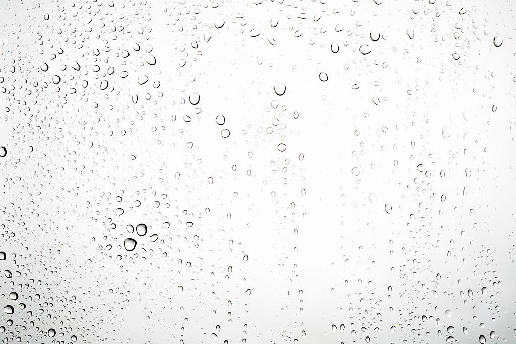 Picture of rain drops going down a window