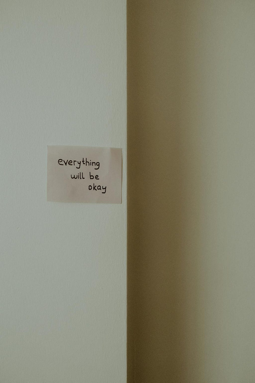 Note Everything Will Be Okay Plastered on a Wall