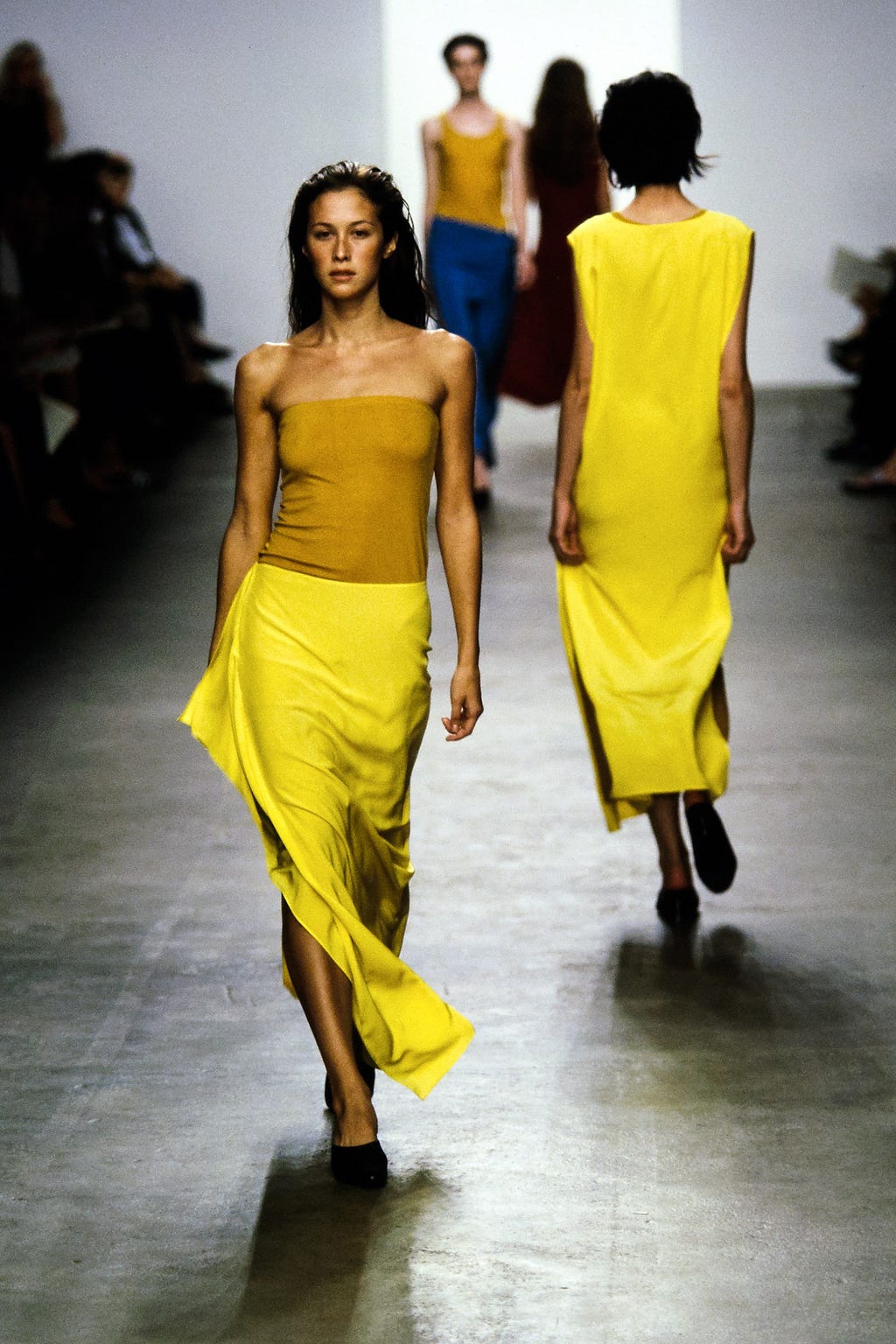 Natane Boudreau modeling a yellow tube top on the runway.