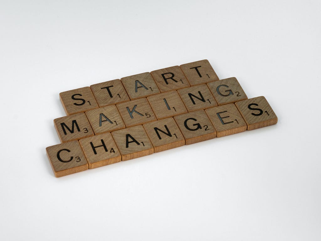 image with Scrabble pieces saying: “start making changes”