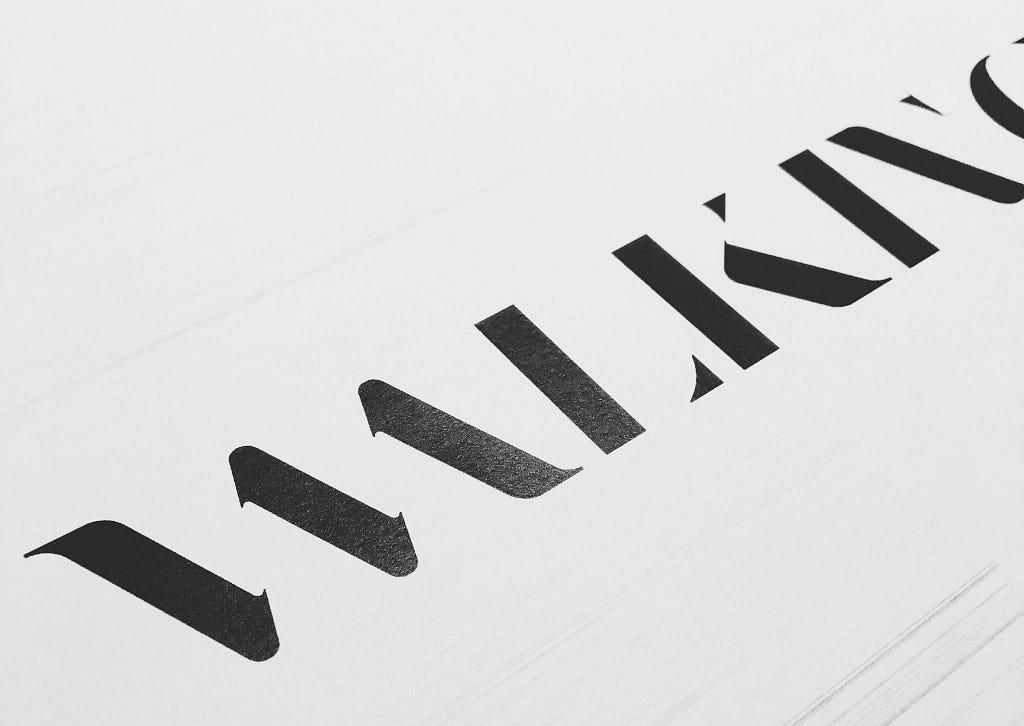 The New Walking Men Logo