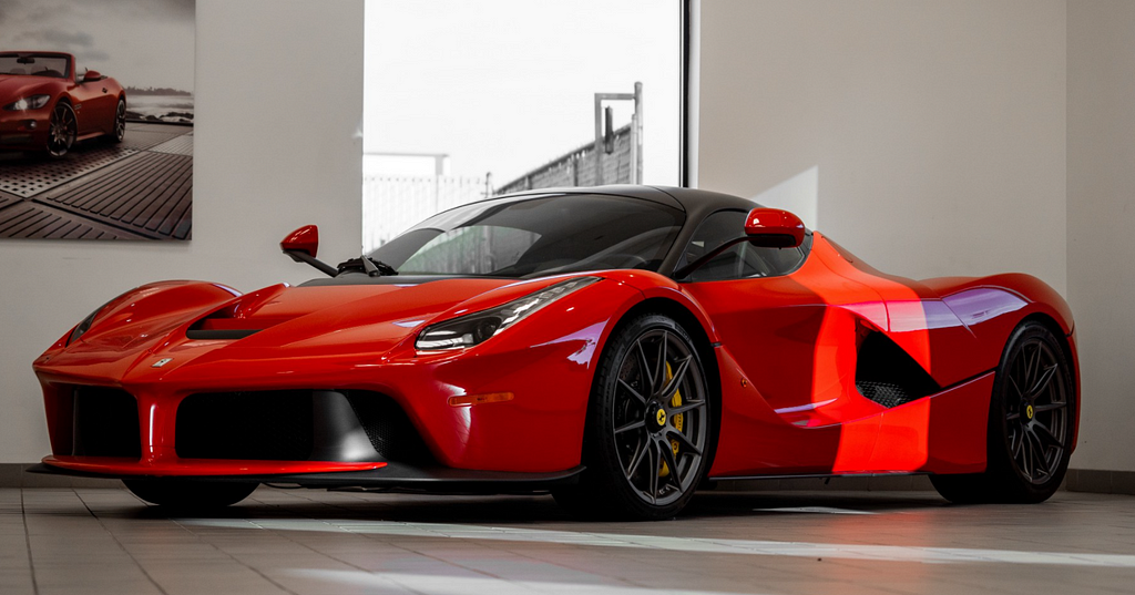 Red Ferrari in a luxury home garage