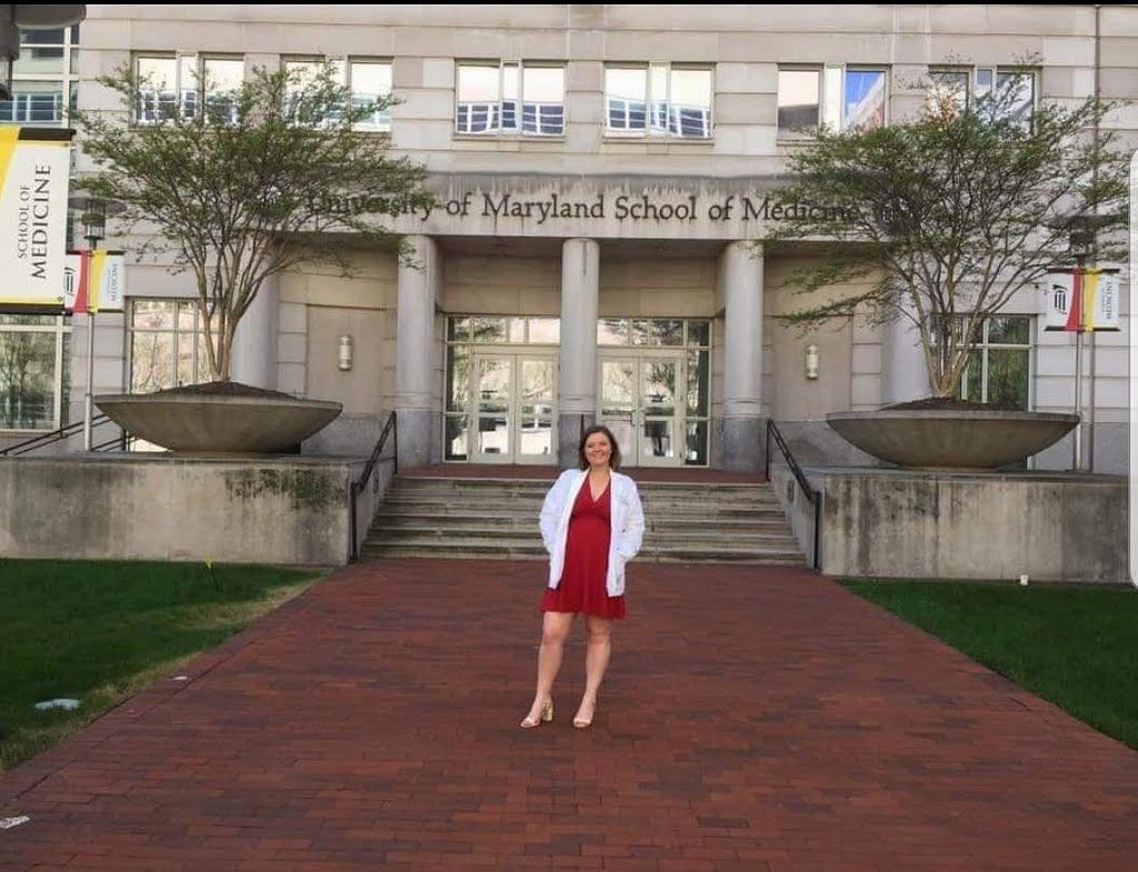 Nikki Federkeil poses in front of the University of Maryland School of Medicine.