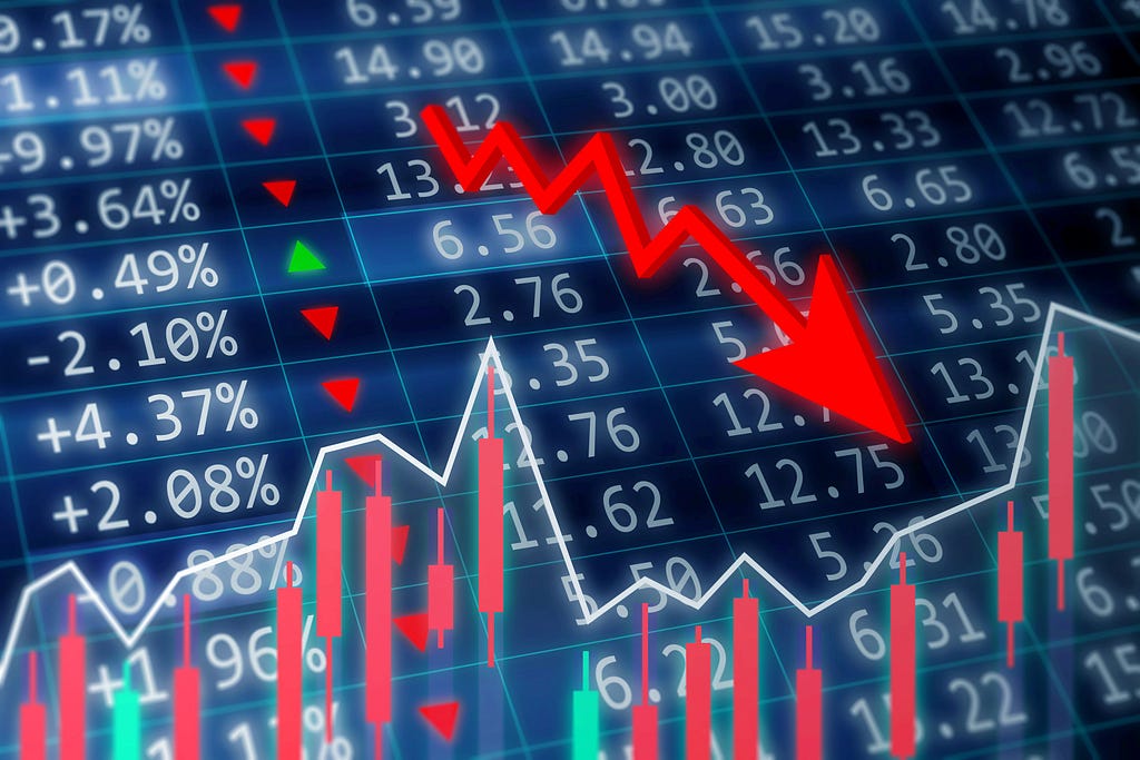 Stock market crash concept. Financial data on a monitor with green arrow going up and red, green candle stick graph chart on dark background