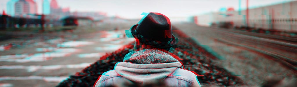 A person with hat looking at the crossroads, the image has a glitch effect.