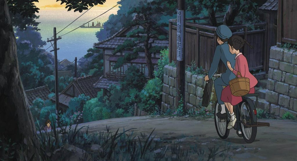 a boy and a girl on a bike