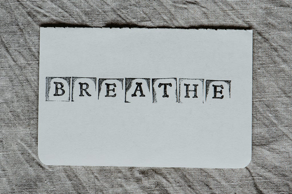 The word breathe on white paper