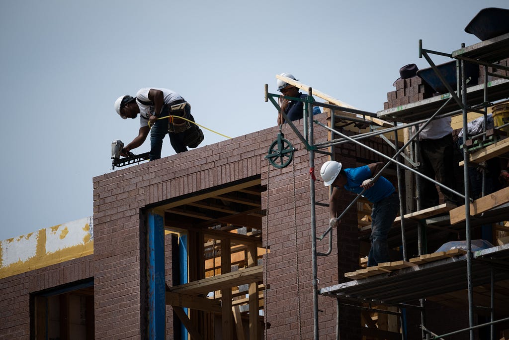 Construction workers at a residential property in Washington, D.C., August 25, 2022. Photo by Graeme Sloan/Reuters