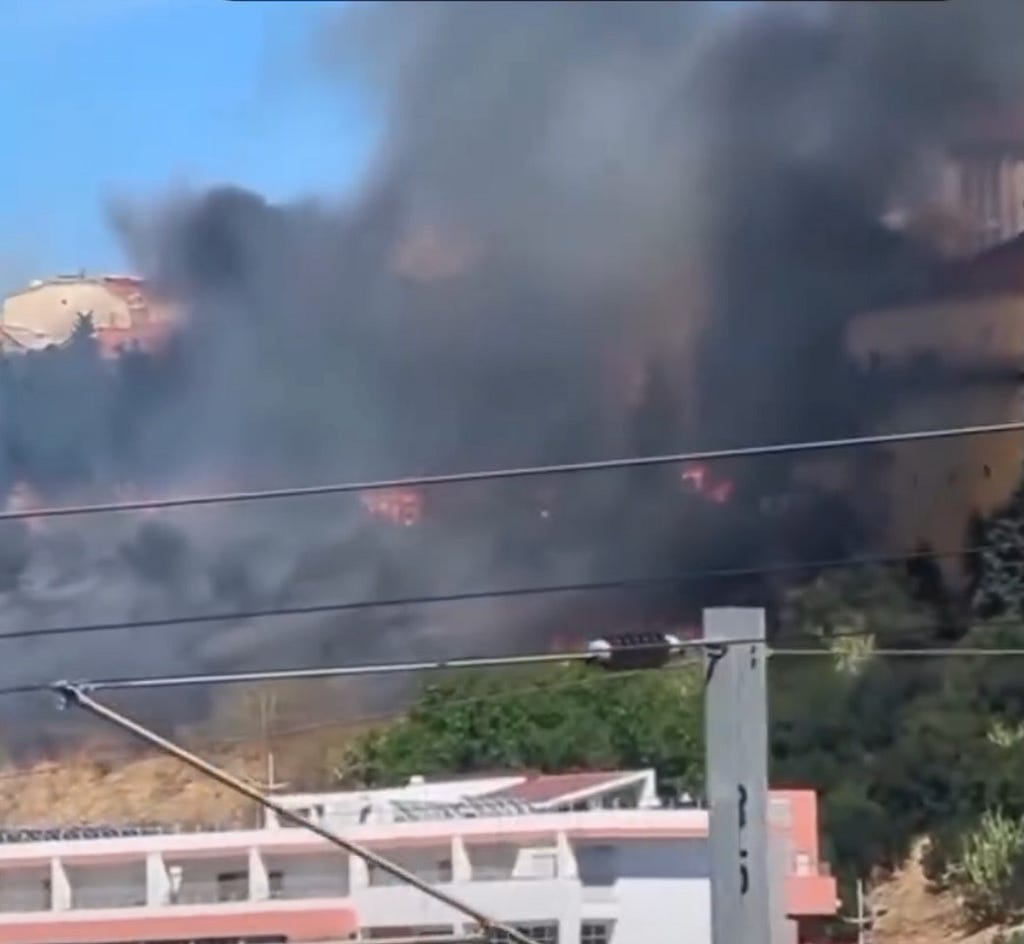 A photo of the fire taking over many buildings in Alcantara
