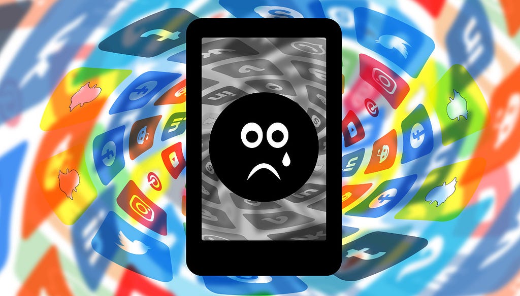 Sad face emoji on a mobile phone screen surrounded by distorted social media logos