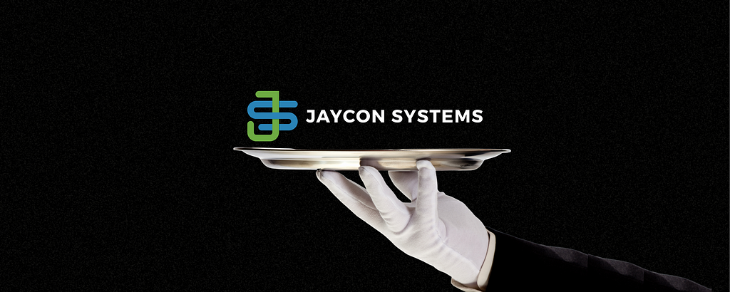 Why Does Your Company Need White-Glove Service? A butler holds the Jaycon Systems logo on a silver platter while wearing white gloves.