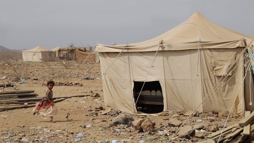 A child plays at a camp of displaced people in Harad District, Yemen, March 3, 2020. Photo by Mohammed Alwafi/Xinhua/Alamy