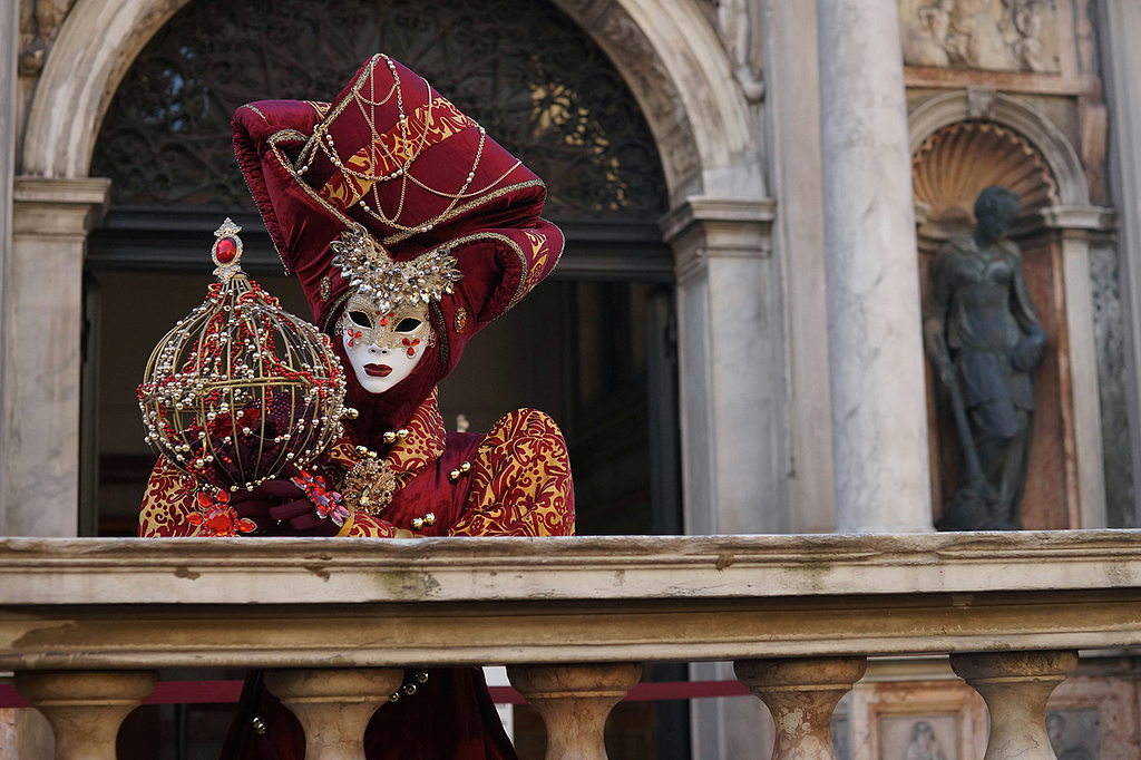 Woman in elaborate Carnevale costume.