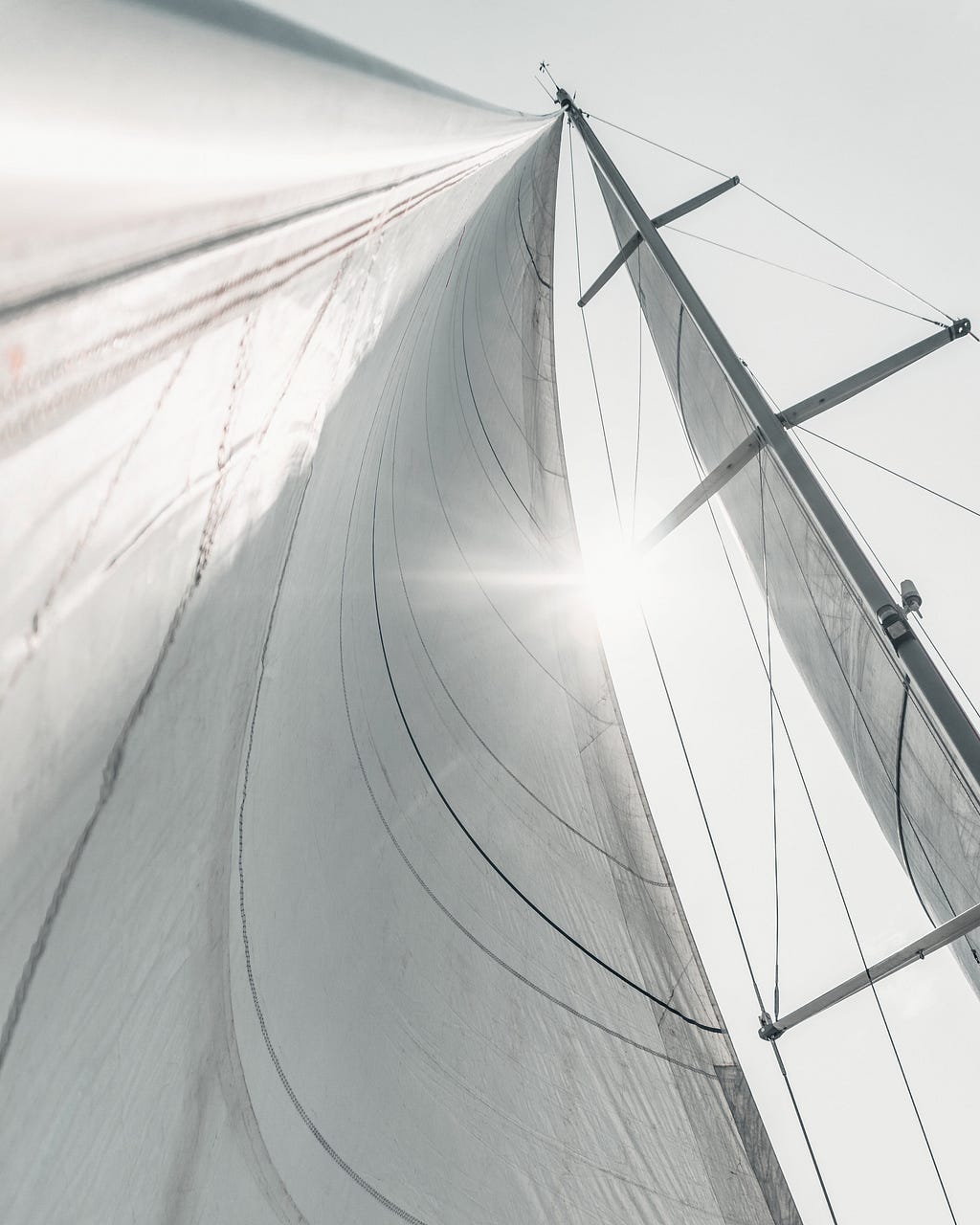 Sailboat sails Photo by Andrea Zignin on Unsplash