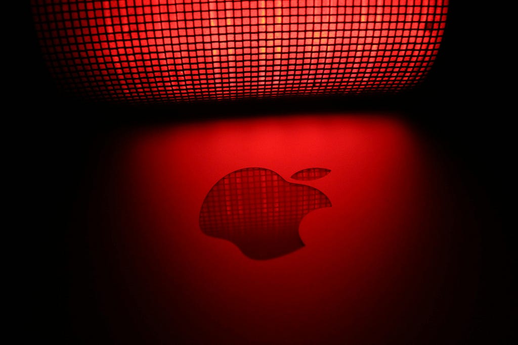 Image of apple’s logo on red